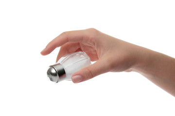 Hand holding a salt shaker