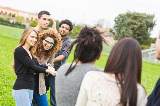 Multiracial People Playing Tug of War