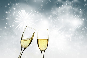 Champagne glasses against holiday lights