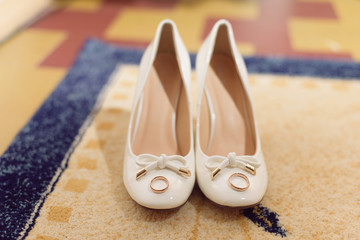 Pair of White Shoes with Rings