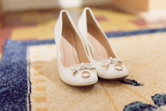 White Shoes with Wedding Rings