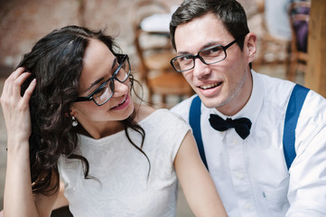 Dating couple talking and relaxing together in cafe.