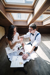 Young couple having a conversation in the indoor cafe.