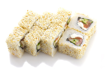 Sushi roll with salmon cheese and vegetables and sesame isolated