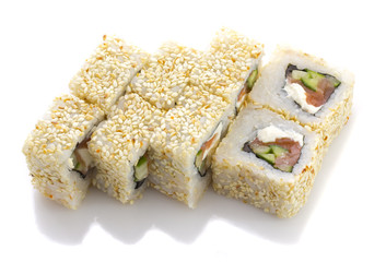 Sushi roll with salmon cheese and vegetables and sesame isolated
