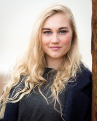 Naklejka premium Young Blond Teenage Girl Thinking On The Beach