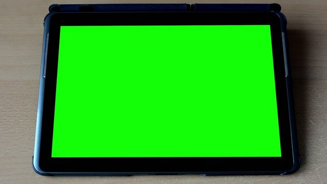 tablet - green screen on the table