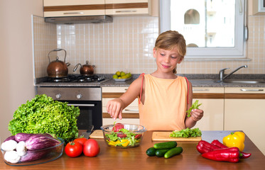Young Girl Cooking. Healthy Food - Vegetable Salad. Diet.