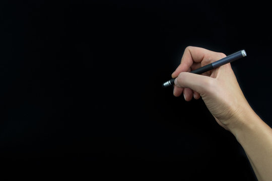 Hand Holding Stylus Isolated On Black Background