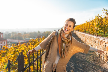 Portrait of happy young woman in autumn outdoors