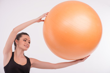 Fototapeta premium Healthy young sportswoman does the exercises
