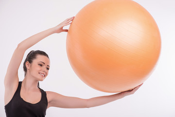Fototapeta premium Healthy young sportswoman does the exercises