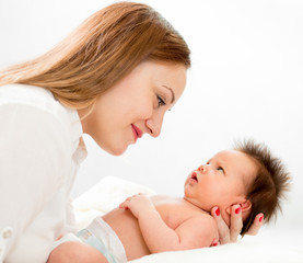 Obraz na płótnie Canvas Happy mother with her newborn baby
