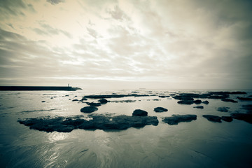 dramatic Atlantic coast at low tide. Tinted