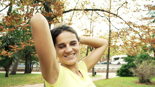 Portrait of happy beautiful woman with long hair in the park
