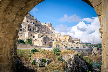 View of Matera through archway, Italy - obrazy, fototapety, plakaty