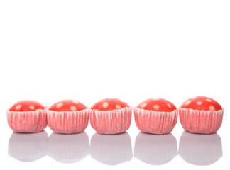Red colored steamed rice polka dot muffin or apam polka dot