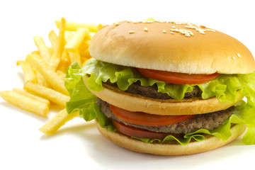 Big and tasty hamburger and fried potatoes isolated 
