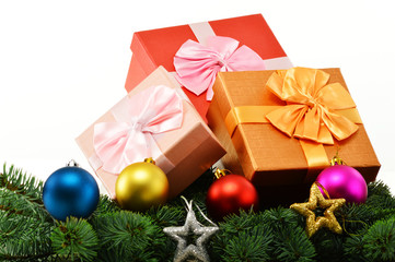 Colorful gift boxes and christmas tree isolated on white