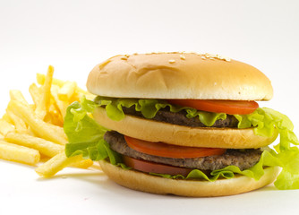 Big and tasty hamburger and fried potatoes isolated 