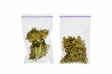 Two bags of different marijuana on a white background