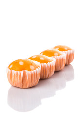 Orange colored steamed rice polka dot muffin or apam polka dot 