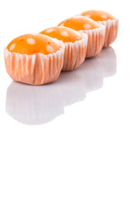 Orange colored steamed rice polka dot muffin or apam polka dot 