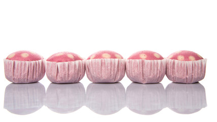 Pink colored steamed rice polka dot muffin or apam polka dot