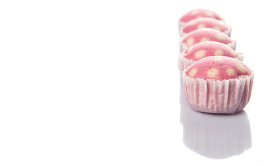 Pink colored steamed rice polka dot muffin or apam polka dot