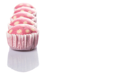 Pink colored steamed rice polka dot muffin or apam polka dot