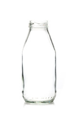 Empty glass bottle of milk with cap