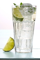 Hugo cocktail with lime, mint and ice cubes