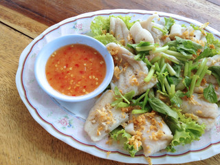 clsoed up boiled fish dip with spicy sauce