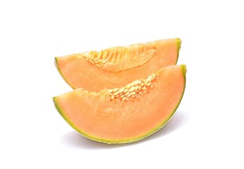 Cantaloupe melon slices isolated on white background