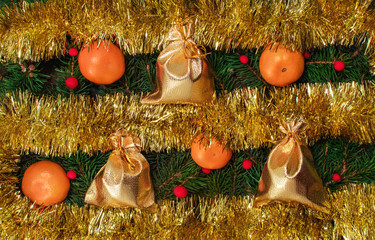 tinsel, gift bags, tangerines and spruce branches