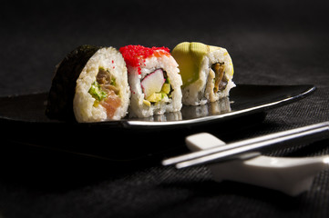Luxurious sushi on black background - japanese cuisine