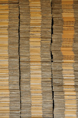 Many unpack paper box stacking on black pallet in front of wareh