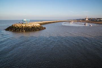 Breakwater harbour wall Herne Bay, Kent as seen from the pier.