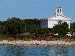 A white church on the graveyard of Olib in Croatia