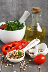 Uncooked multigrain rice in porcelain measuring spoons