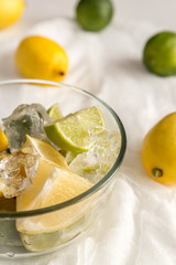 Lemons and limes on the white background