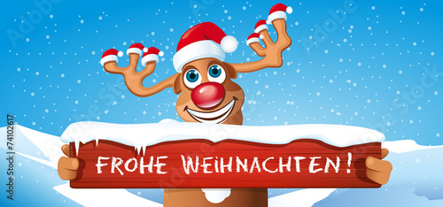 &quot;lustiges Rentier mit Schild Frohe Weihnachten&quot; Stockfotos und