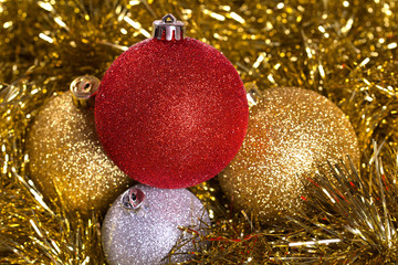 Christmas balls with yellow tinsel