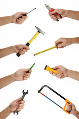 Male hands with lots of house improvement tools on white