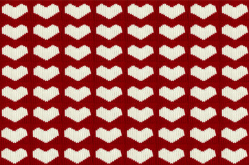 knit white hearts of the warm woolen threads