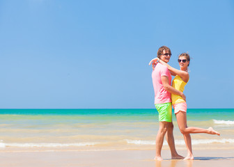 happy young couple at a tropical beach