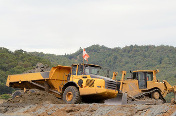 Large bulldozer leveling out fill at a airport runway 