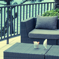 Al fresco cafe with rattan furniture on the terrace