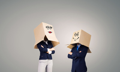 Business people wearing boxes