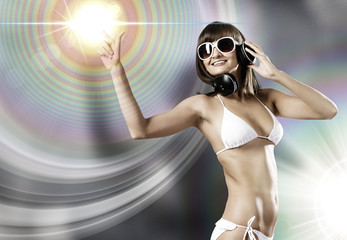 Fototapeta premium Bikini girl wearing headphones